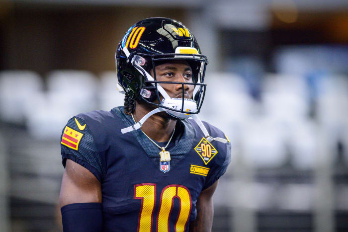 Receiver Curtis Samuel models the Washington Commanders black alternate uniforms.